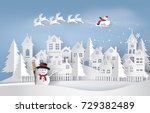 Santa Claus flying with sleigh above snow village, snowman and paper cut houses.