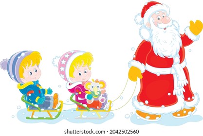Santa Claus friendly smiling, waving his hand in greeting and sledding happy little kids on a snowy winter day, vector cartoon illustration isolated on a white background