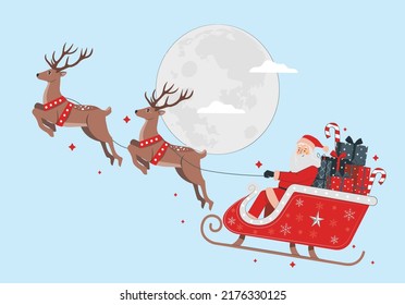 Santa Claus get a move to ride on their reindeer. Magic Santa's sleigh flying over Christmas fairy forest on the background of huge moon.