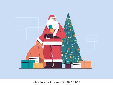 santa claus with gift box sack happy new year merry christmas holiday celebration concept