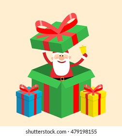 santa claus with gift boxes and bell