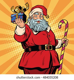 Santa Claus with a gift, Christmas and new year. pop art retro vector illustration. Fairy tale character