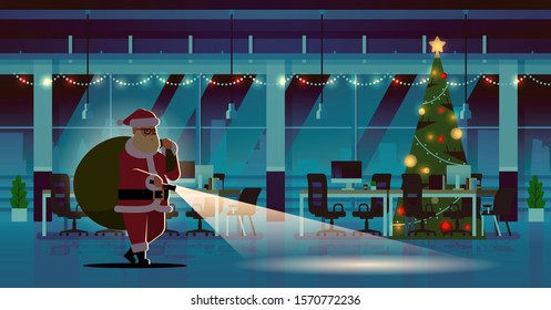 santa claus with gifts sack using flashlight christmas new year holidays celebration concept modern night decorated office interior full length horizontal flat vector illustration