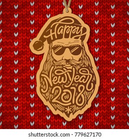 Santa Claus with glasses and big beard with the typography Happy New Year 2018 on red knitted background. Wooden Christmas decoration. Vector illustration.