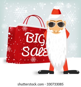 Santa Claus with glasses standing near a red big sale shopping bag. Sale, christmas, x-mas and holidays concept