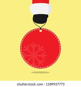 Santa claus hand hold red price tag, White seam and Snowflake on Round background. flat vector design, Isolated on yellow background.