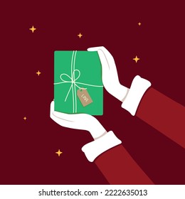 Santa Claus hand show or holding green gift box, Christmas concept.