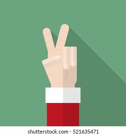 Santa Claus hand show victory sign on green background