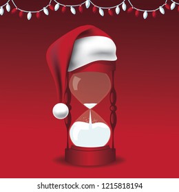 Santa Claus hat on an hourglass signifying that Christmas has arrived. String of Christmas lights above. EPS10 vector illustration.