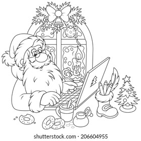 Santa Claus with his laptop checking Christmas email