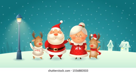 Santa Claus his wife Mrs Claus and Reindeers celebrate Christmas - winter night scene