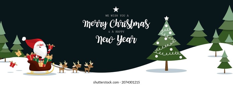 Santa Claus hold gift box on sleigh with a herd of reindeers and Christmas tree in pine tree forest on snow hill and dark sky with we wish you a Merry Christmas and a Happy New Year text.