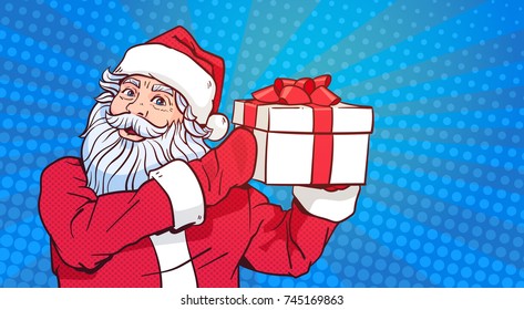 Santa Claus Hold Gift Box Over Pop Art Comic Background Merry Christmas And Happy New Year Poster Design Vector Illustration
