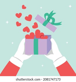 Santa Claus holding gift box and many hearts inside the box, happy new year concept.