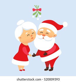 Santa Claus kiss his wife Mrs. Santa under the mistletoe. Romantic Christmas tradition. Cute family couple together. Mother and Father Christmas