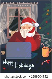 Santa Claus at the laptop with a Christmas tree