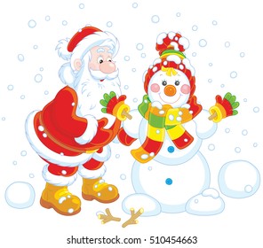 Santa Claus making a funny smiling snowman with a cap, a scarf and mittens