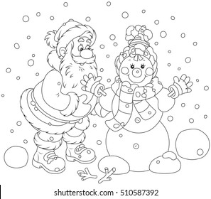 Santa Claus making a funny smiling snowman with a cap, a scarf and mittens