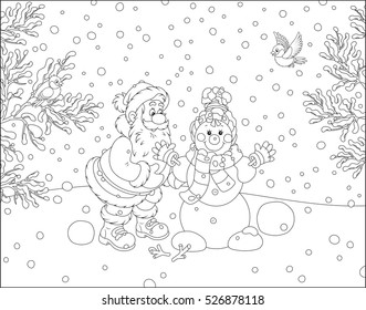 Santa Claus making a funny smiling snowman with a cap, a scarf and mittens