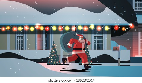 santa claus in mask running with sack full of gifts happy new year merry christmas holidays celebration concept night winter street with decorated houses full length horizontal vector illustration