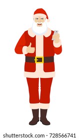 Santa Claus with mobile phone showing thumb up. Full length portrait of Santa Claus in a flat style. Vector illustration.
