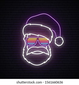 Santa Claus neon sign. Hipster wearing in shutter glasses and Santa Claus hat. Bright Christmas vector illustration.