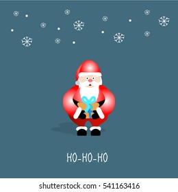 Santa Claus in red costume holding brown gift box on dark background 