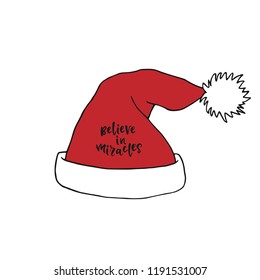 Santa Claus red hat with believe in miracles lettering. Christmas decoration.