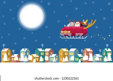 Santa Claus and reindeer driving a sleigh car with deer horns flying over a winter town at night with glowing moon, colorful buildings, trees, snowman and snow