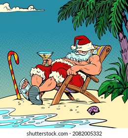 Santa Claus is resting at a resort by the sea on the beach. Christmas and New Year. Winter seasonal holiday