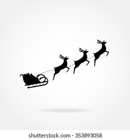 Santa Claus rides in a sleigh in harness on the reindeer 