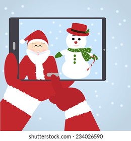 Santa Claus selfie with snowman