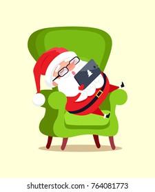 Santa Claus sitting in green big armchair with modern tablet, winter cartoon character rest in chair with gadget computer technologies vector poster