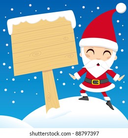 Santa Claus standing next to a blank wooden sign post