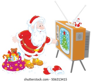 Santa Claus turning on his old wood TV set 