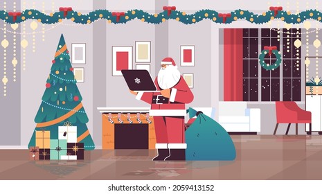 santa claus using laptop social media network merry christmas happy new year winter holidays celebration