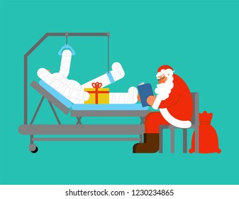 Santa Claus Visits in hospital. Grandfather reads book and gives gift. Patient bandaged  on Hospital bed. Christmas in hospital. Medical care