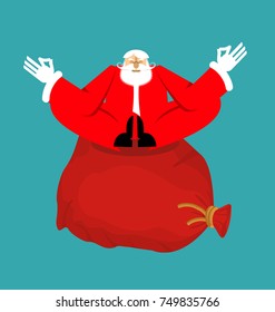 Santa Claus yogi and Red bag with gifts. Christmas yoga. New Year Zen. Grandfather in lotus position. Xmas Enlightenment and relaxation. 