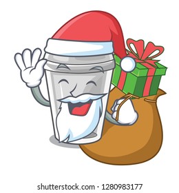 Santa with gift plastic cup on a cartoon table