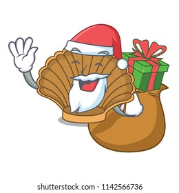 Santa with gift shell with pearl mascot cartoon