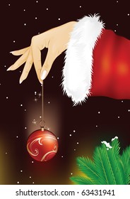 Santa girl hand holding christmas bauble