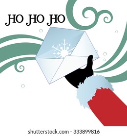 Santa hand with open envelope containing a snowflake  Ho ho ho greeting and copyspace  for your input on bottom left 
