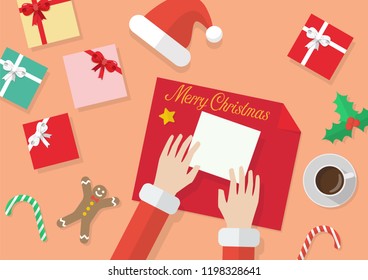 Santa hands give wrapped christmas present in paper. Merry Christmas and Happy New Year