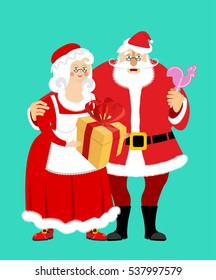 Santa and Mrs. Claus isolated. Christmas family. Woman in red dress and white apron. Cheerful elderly. New Year menage. Gift and Rooster Lollipop
