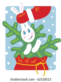 Santa pulls a rabbit out of the bag. Rabbit keeps a Christmas tree.