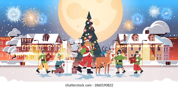 santa woman standing with deer and mix race elves in masks new year merry christmas holiday celebration greeting card fireworks in night sky cityscape background full length horizontal vector