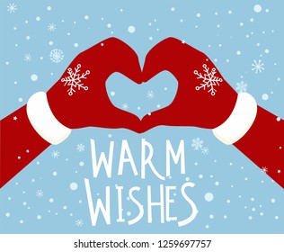Santa's hands making a heart sign. Chrismas greeting card