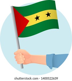Sao Tome and Principe flag in hand. Patriotic background. National flag of Sao Tome and Principe vector illustration