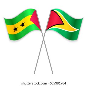 Sao Tomean and Guyanese crossed flags. Sao Tome and Principe combined with Guyana isolated on white. Language learning, international business or travel concept.