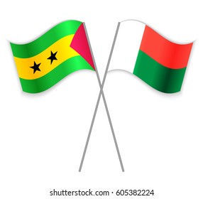 Sao Tomean and Malagasy crossed flags. Sao Tome and Principe combined with Madagascar isolated on white. Language learning, international business or travel concept.